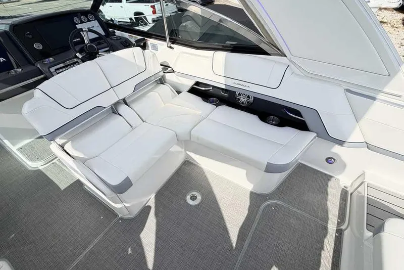 Slide: The Image of 2022 Formula 330 Crossover Bowrider I/O interior with luxurious white seating and modern dashboard. - 21