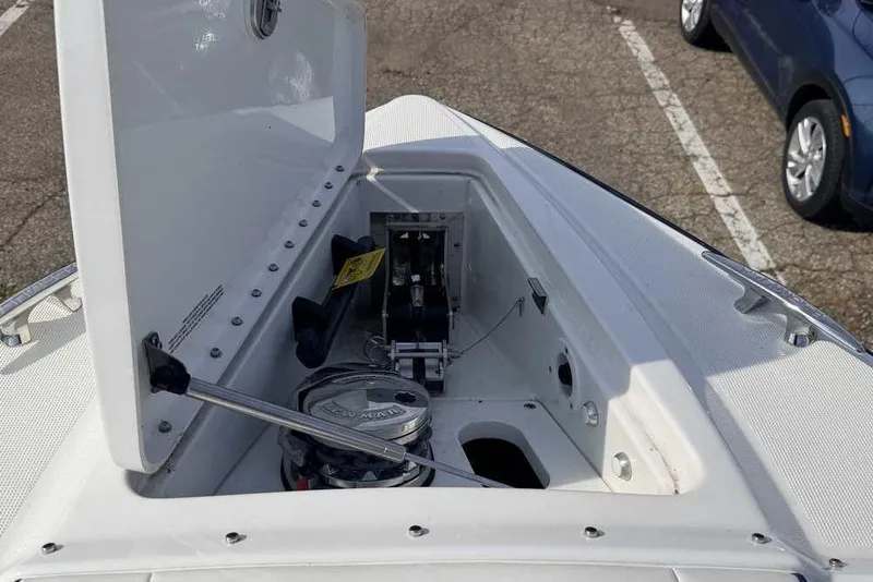 Slide: The Image of Open storage compartment on 2022 Formula 330 Crossover Bowrider I/O boat. - 47