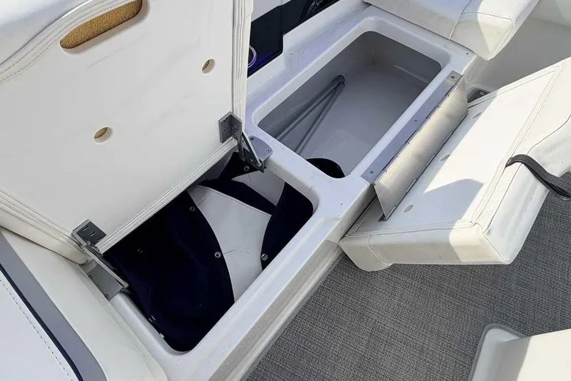 Slide: The Image of 2022 Formula 330 Crossover Bowrider I/O storage compartments with open seats. - 45