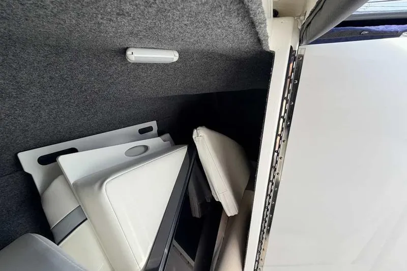 Slide: The Image of Interior storage of 2022 Formula 330 Crossover Bowrider I/O with cushions and panels. - 41