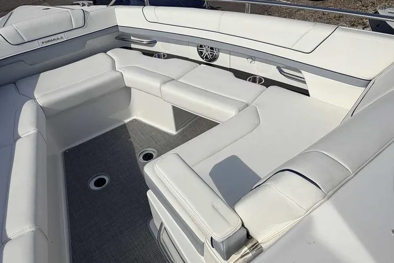 Slide: The Image of 2022 Formula 330 Crossover Bowrider I/O interior with luxurious white seating and sleek design. - 43