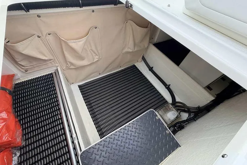 Slide: The Image of Interior storage area of 2022 Formula 330 Crossover Bowrider I/O with organized compartments. - 38