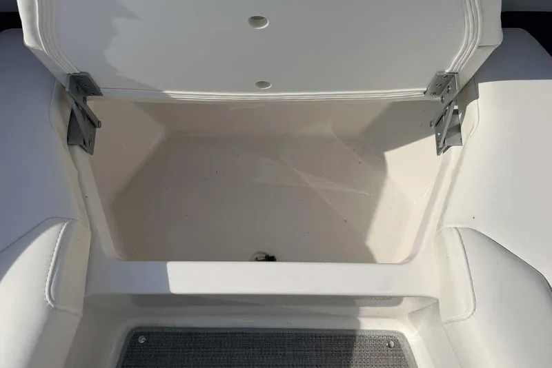 Slide: The Image of Open storage compartment on 2022 Formula 330 Crossover Bowrider I/O boat. - 46