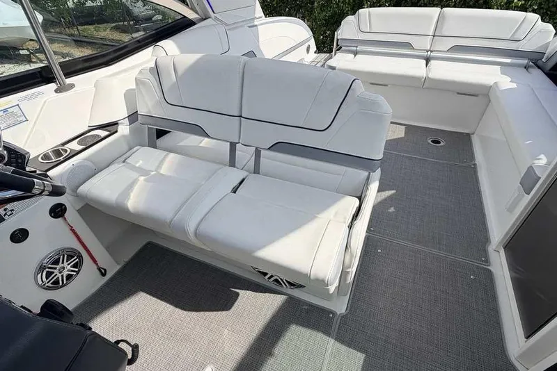 Slide: The Image of 2022 Formula 330 Crossover Bowrider I/O interior with white seating and modern design. - 25