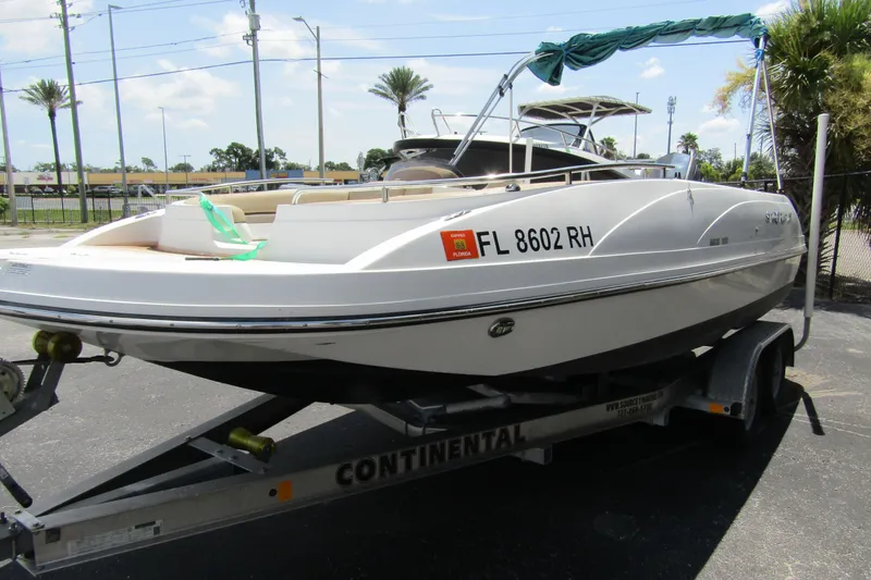 Slide: The Image of 2017 SMOKERCRAFT MDX 191 boat on trailer, parked outdoors, Florida registration visible. - 3