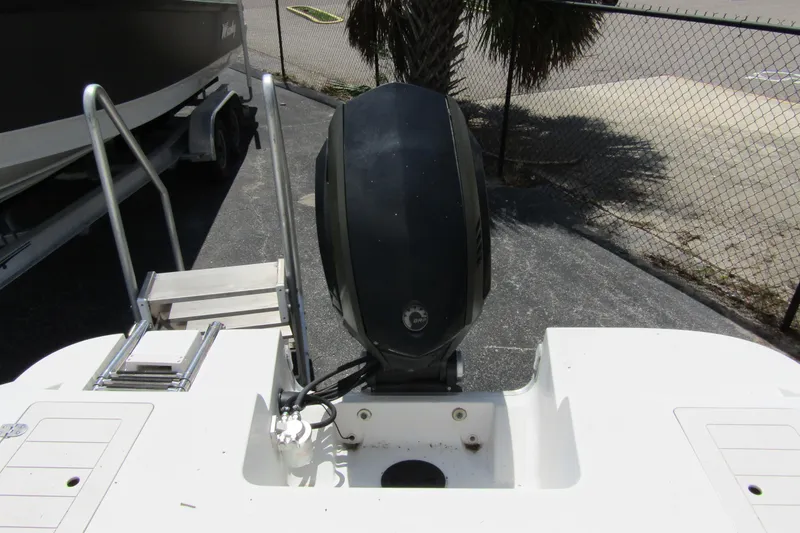 Slide: The Image of 2017 SMOKERCRAFT MDX 191 boat with outboard motor and swim ladder. - 8