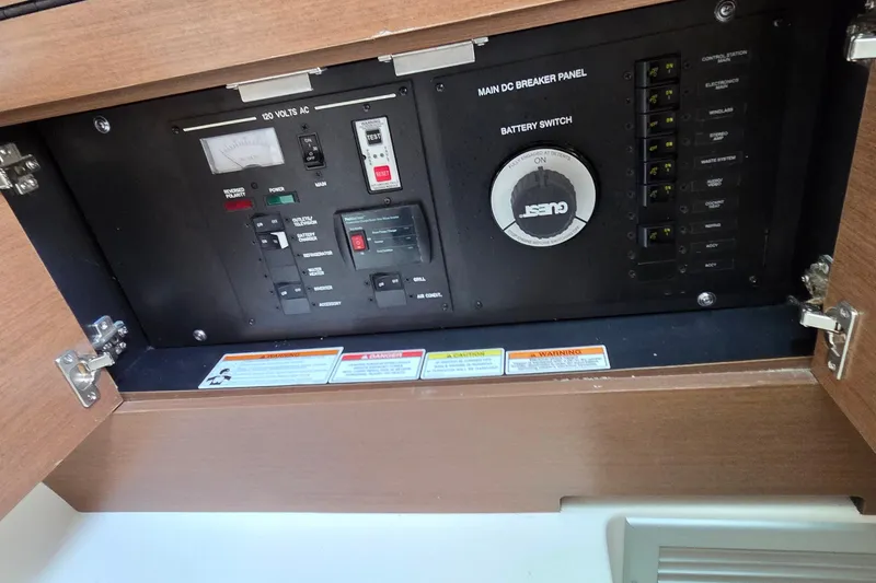 Slide: The Image of Electrical panel of a 2016 Sea Ray SLX 350 boat with switches and gauges. - 22