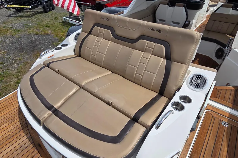 Slide: The Image of Luxurious seating on a 2016 Sea Ray SLX 350 boat with elegant tan upholstery. - 17