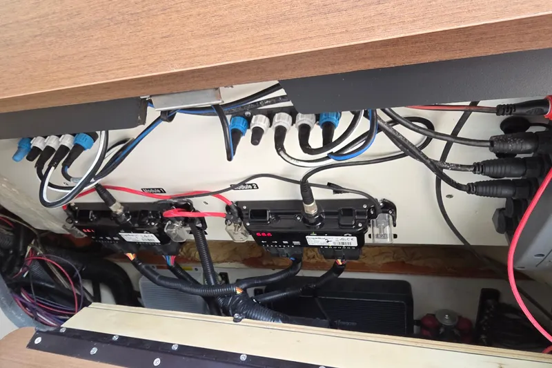 Slide: The Image of Electrical wiring and components inside a 2016 Sea Ray SLX 350 boat. - 23