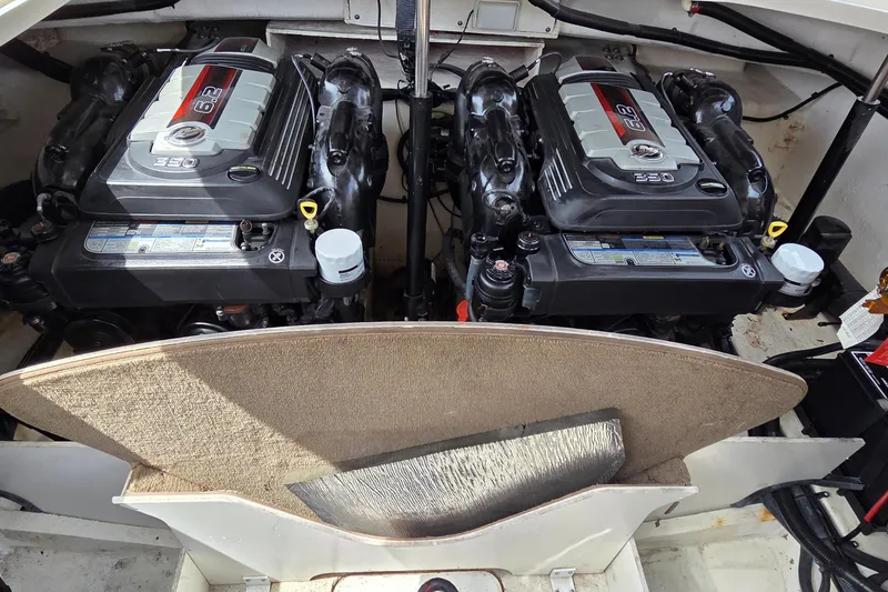 Slide: The Image of Twin engines in a 2016 Sea Ray SLX 350 boat, showcasing powerful marine engineering. - 19
