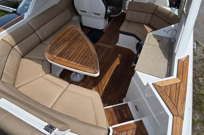 Slide: The Image of Luxurious interior of 2016 Sea Ray SLX 350 with elegant wood and leather seating. - 15