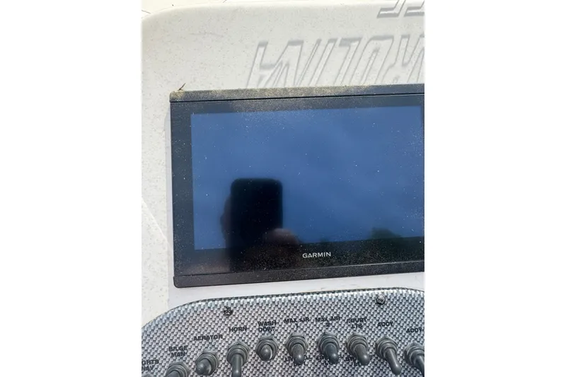 Slide: The Image of Garmin display and control panel on 2014 Carolina Skiff 198 DLV boat. - 13