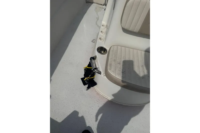 Slide: The Image of 2014 Carolina Skiff 198 DLV boat interior with seating and cup holders. - 22