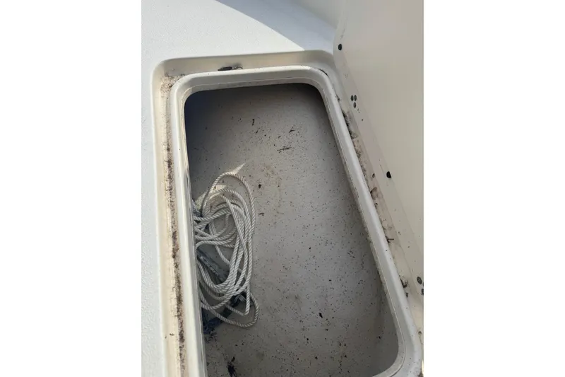 Slide: The Image of Storage compartment with rope in a 2014 Carolina Skiff 198 DLV boat. - 21