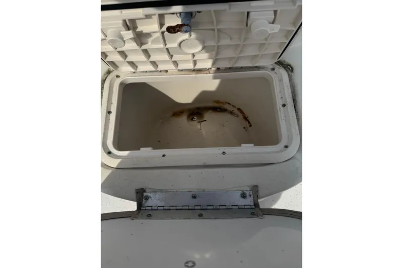Slide: The Image of Open storage compartment on a 2014 Carolina Skiff 198 DLV boat. - 18