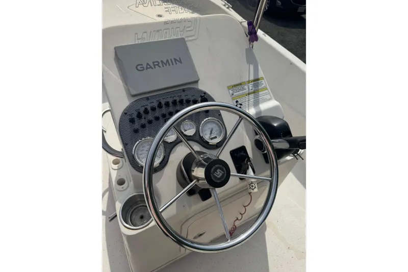 Slide: The Image of Steering console of a 2014 Carolina Skiff 198 DLV with Garmin navigation system. - 16