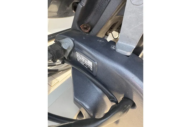 Slide: The Image of Close-up of a 2014 Carolina Skiff 198 DLV engine component with visible serial number. - 6