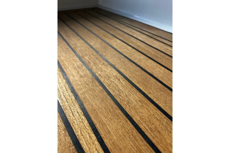 Slide: The Image of Teak deck of 2013 AdmiralsTender C28 boat, featuring sleek black caulking lines. - 17