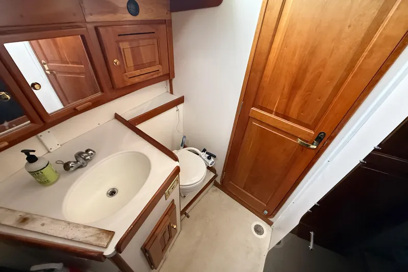 Slide: The Image of Compact wooden bathroom interior on a 2000 Tartan 3700 sailboat. - 25
