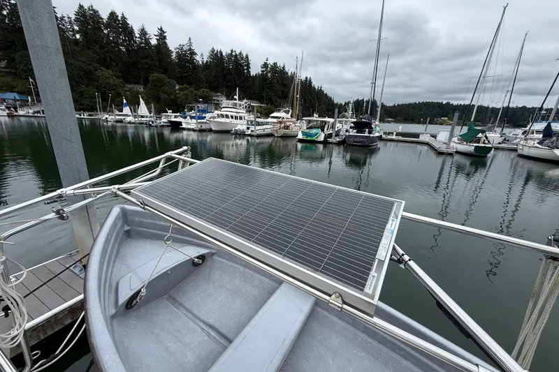 Slide: The Image of Solar panel on Tartan 3700 sailboat docked at marina, surrounded by other boats. - 41