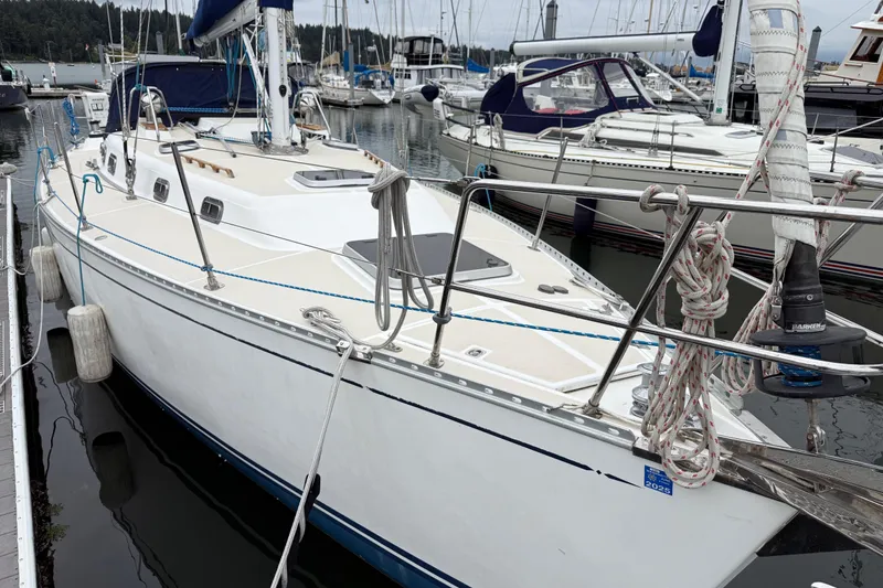 Slide: The Image of Sailboat Tartan 3700, year 2000, docked in a marina with other boats. - 38