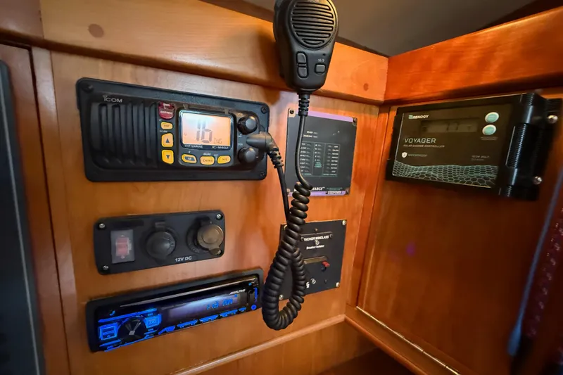 Slide: The Image of Control panel of a 2000 Tartan 3700 yacht with communication and solar charge devices. - 28