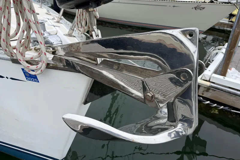 Slide: The Image of Polished anchor on Tartan 3700 sailboat, 2000 model, docked with ropes. - 49
