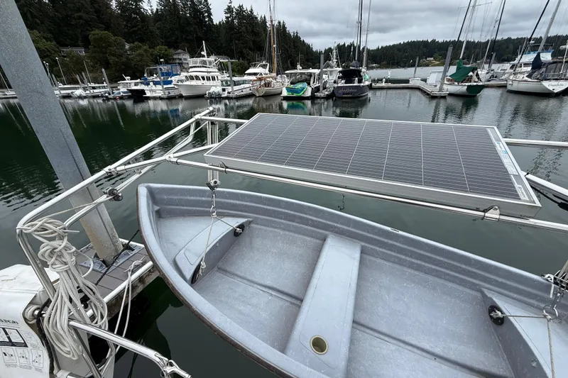Slide: The Image of Docked boats with solar panel and dinghy, Tartan 3700, 2000 model, marina setting. - 47