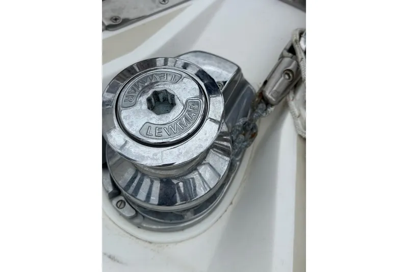 Slide: The Image of Lewmar winch on 2000 Tartan 3700 sailboat deck, featuring chain and metal components. - 50
