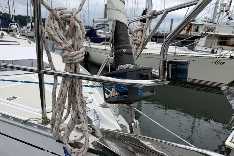 Slide: The Image of Tartan 3700 sailboat, 2000 model, docked with coiled ropes and rigging details. - 48