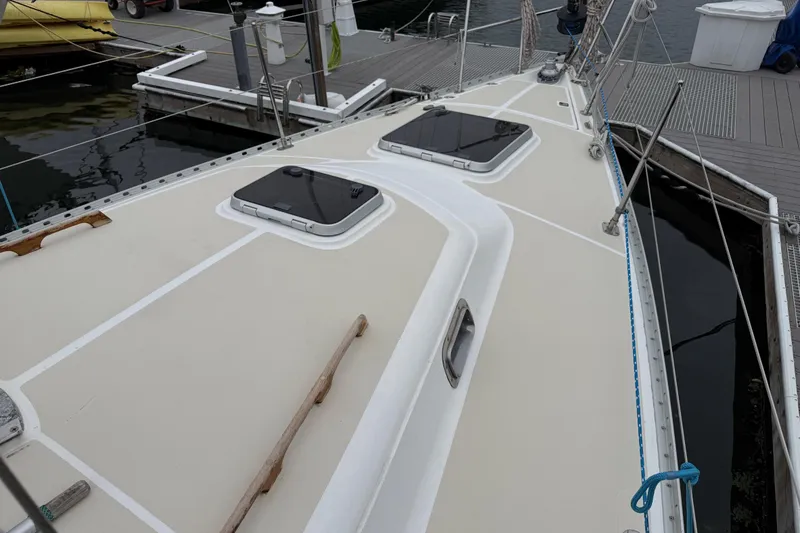 Slide: The Image of Tartan 3700 sailboat deck, 2000 model, docked at marina with hatches and rigging. - 7