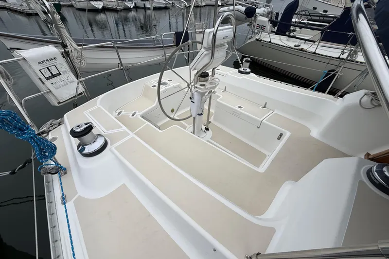Slide: The Image of Tartan 3700 sailboat cockpit, 2000 model, featuring clean design and marina backdrop. - 5