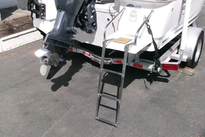 Slide: The Image of 2015 Sea Fox 180 Viper boat with ladder and outboard motor on trailer. - 21