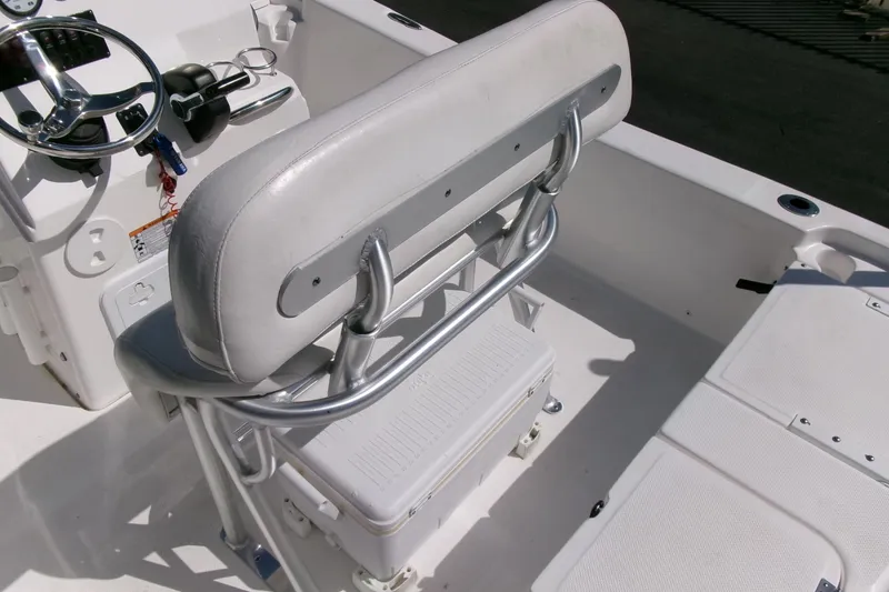 Slide: The Image of 2015 Sea Fox 180 Viper boat interior with steering wheel and cushioned seating. - 15