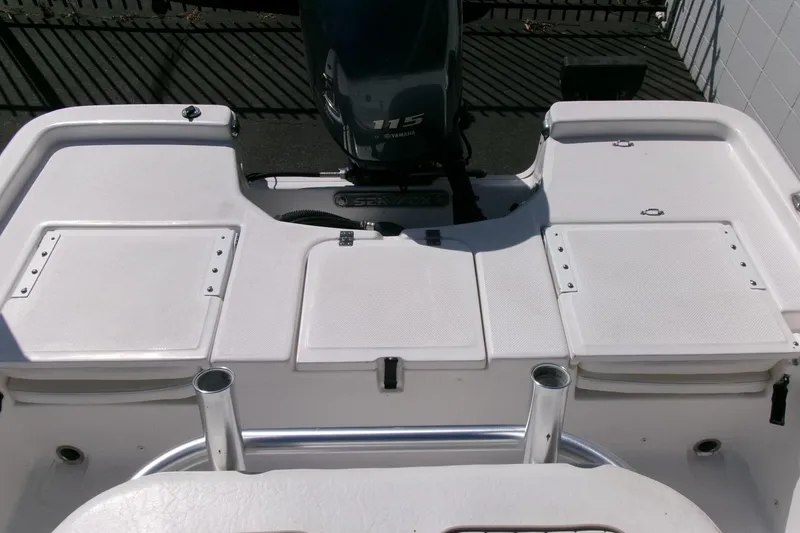 Slide: The Image of 2015 Sea Fox 180 Viper boat deck with Yamaha 115 engine, featuring storage compartments. - 17