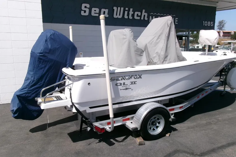 Slide: The Image of 2015 Sea Fox 180 Viper boat on trailer, covered and parked at dealership. - 22