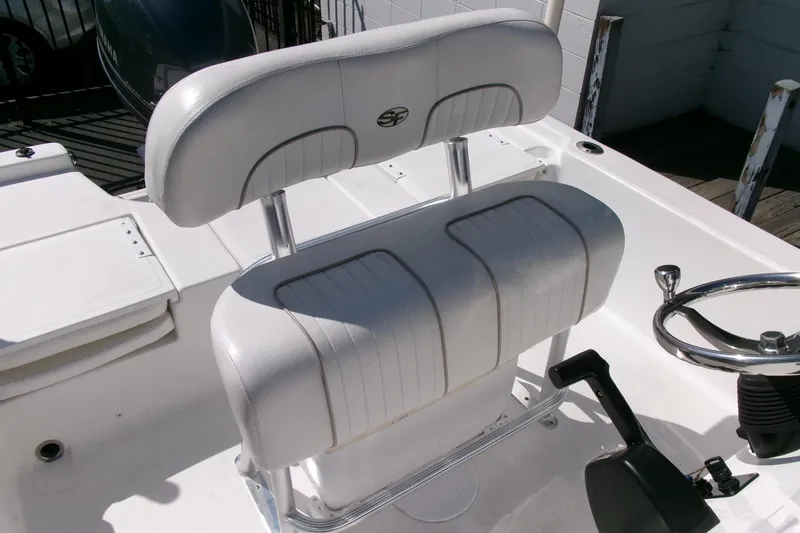 Slide: The Image of 2015 Sea Fox 180 Viper boat interior with white seating and steering wheel. - 13