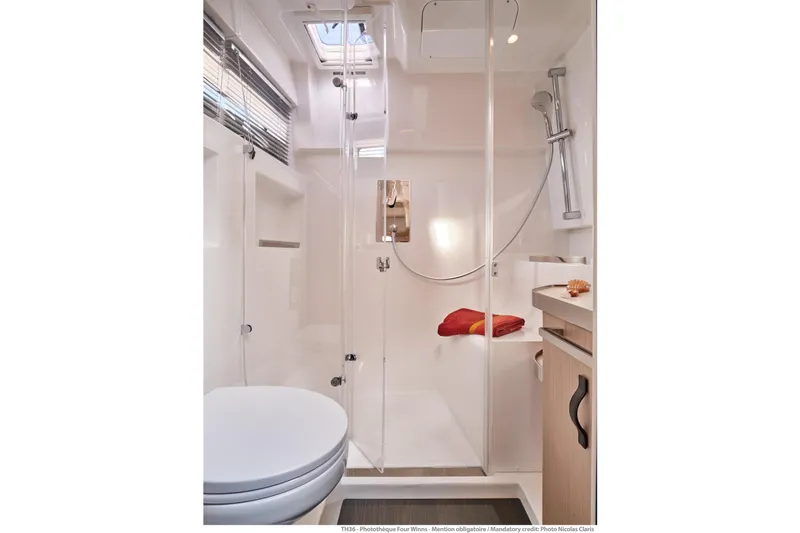 Slide: The Image of Modern bathroom interior of 2026 Jeanneau TH38 yacht with shower and sleek design. - 1