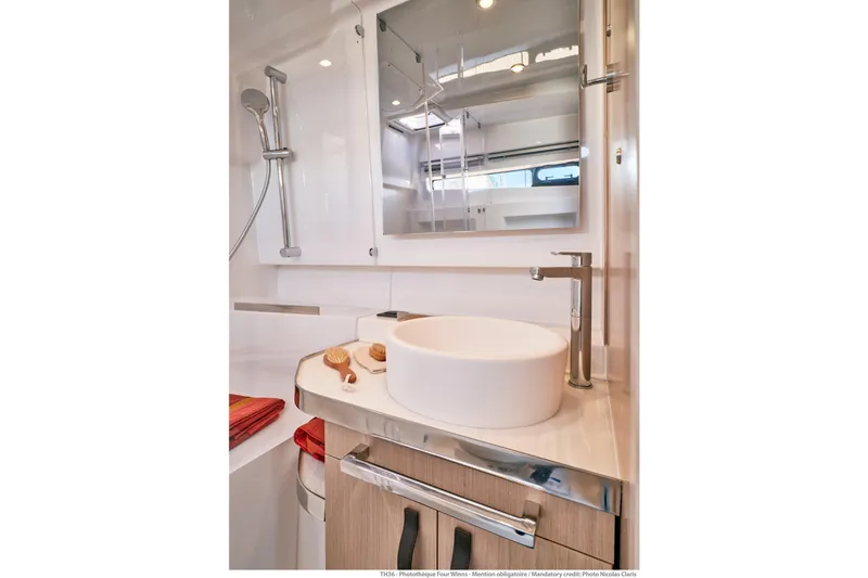 Slide: The Image of Modern bathroom in 2026 Jeanneau TH38 yacht with sleek fixtures and elegant design. - 2