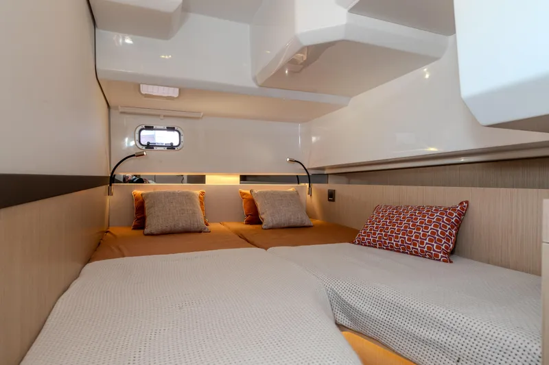 Slide: The Image of Luxurious cabin interior of 2026 Jeanneau TH38 yacht with cozy bedding and modern design. - 7