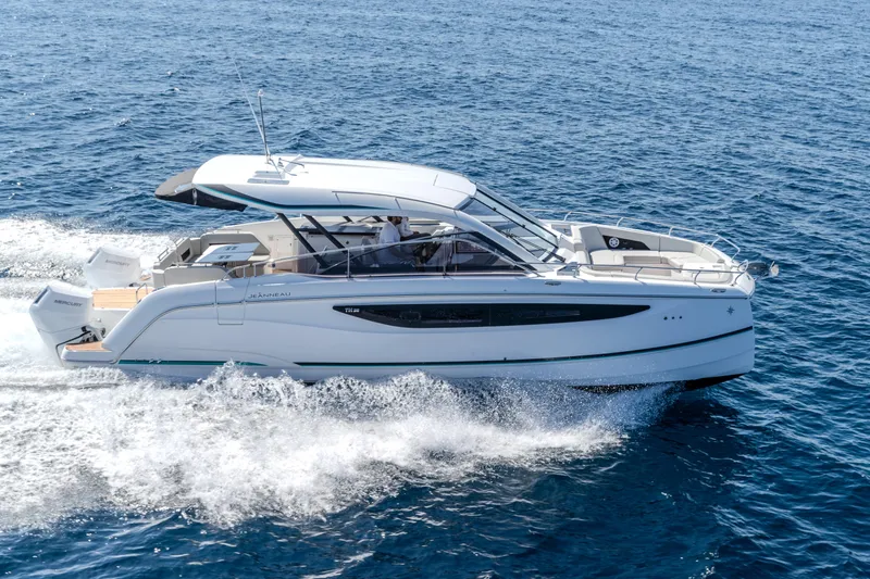 The Image of 2026 Jeanneau TH38 motor yacht cruising on open sea, showcasing sleek design and performance. - 0
