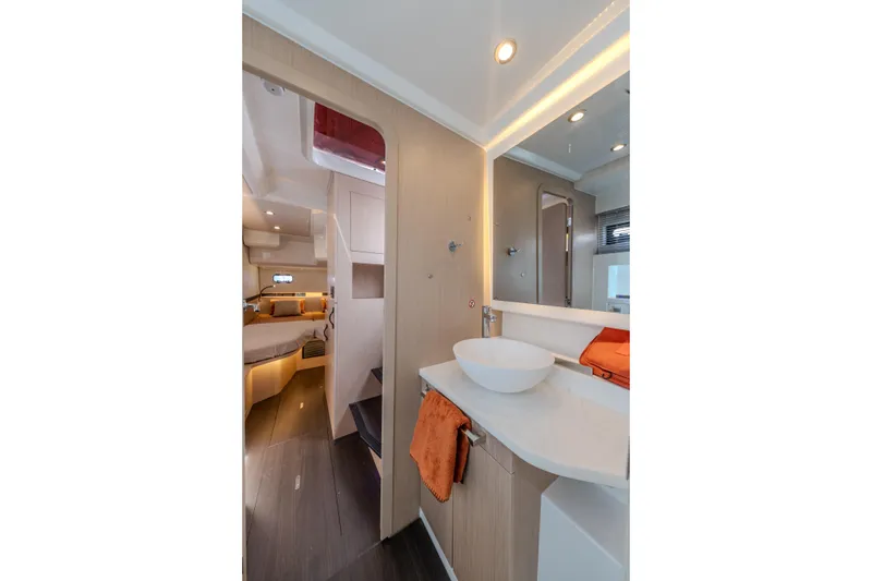 Slide: The Image of Luxurious interior of 2026 Jeanneau TH38 yacht featuring modern bathroom and cozy cabin. - 6