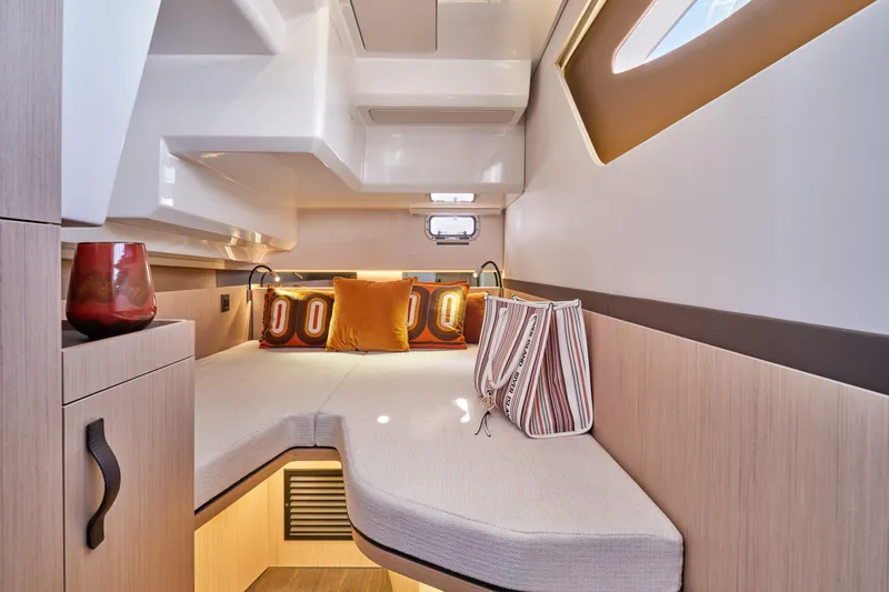 Slide: The Image of Luxurious interior cabin of 2026 Jeanneau TH38 yacht with modern decor and cozy seating. - 4