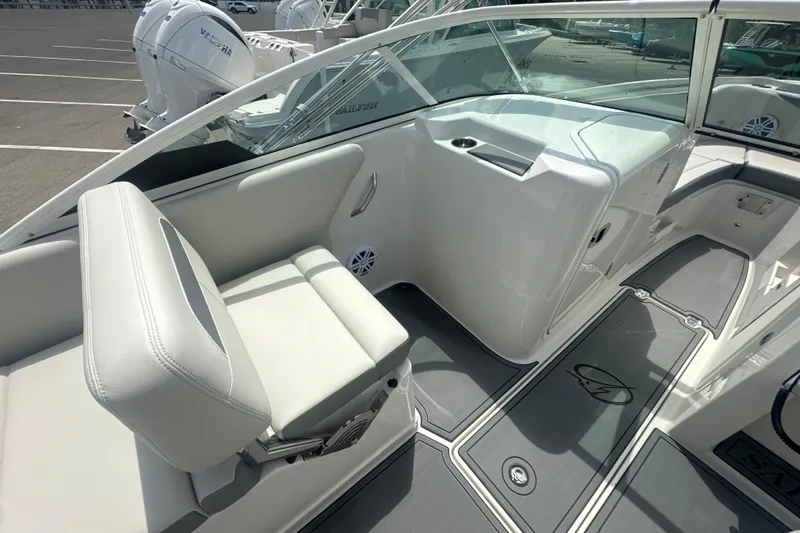 Slide: The Image of 2026 Sailfish 236 DC boat interior with white seating and modern design. - 33