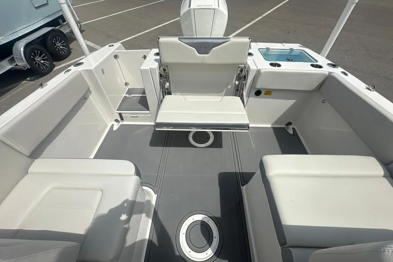 Slide: The Image of 2026 Sailfish 236 DC boat interior with seating and storage compartments. - 17