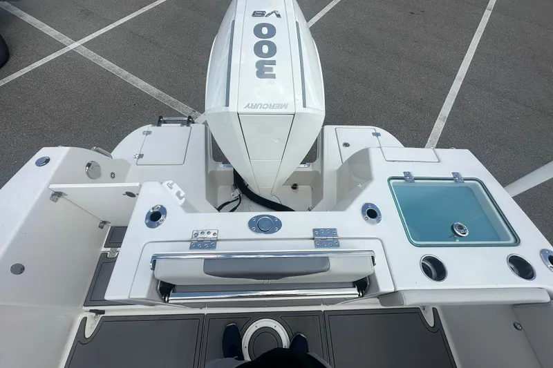 Slide: The Image of 2026 Sailfish 236 DC boat with Mercury 300 engine, featuring a sleek deck layout. - 18