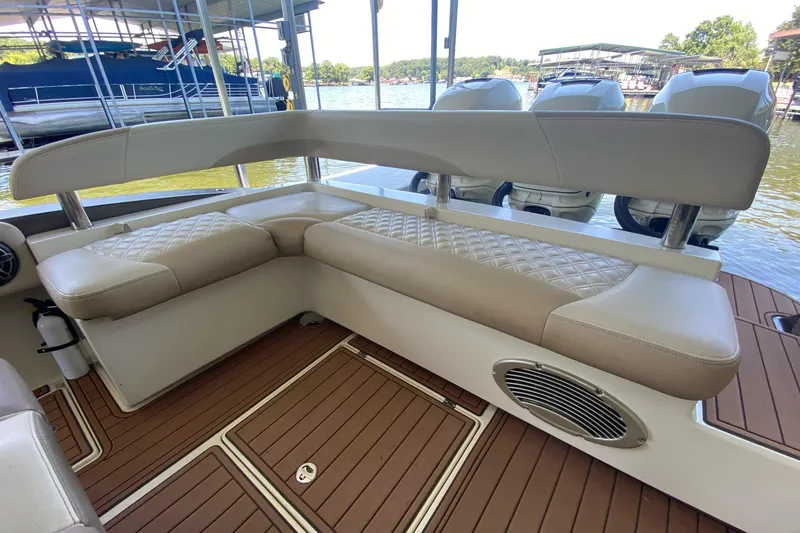 Slide: The Image of Luxurious seating on 2015 Statement 380 Open boat with quilted upholstery and wooden deck. - 13
