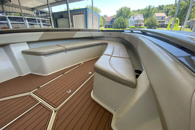 Slide: The Image of Luxurious seating area on a 2015 Statement 380 Open boat with teak flooring. - 9