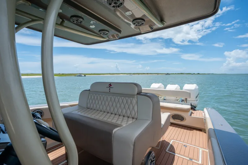 Slide: The Image of 2015 Statement 380 Open boat interior with luxurious seating, overlooking serene waters. - 9