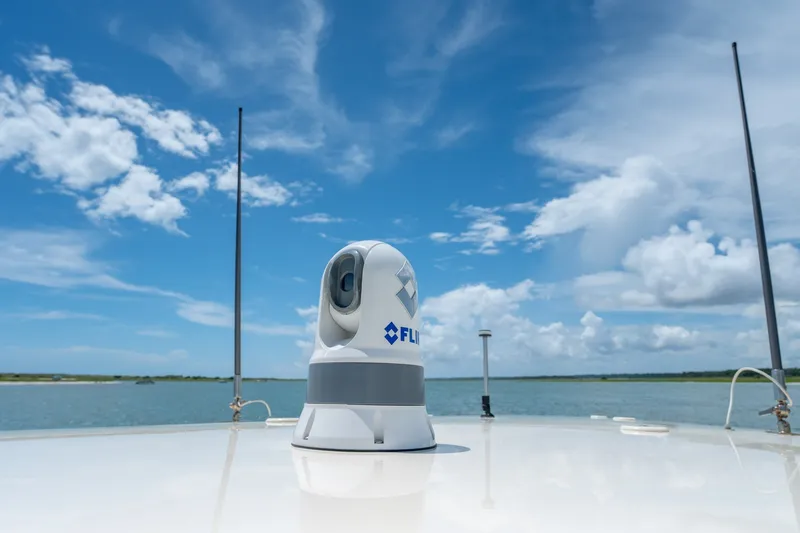 Slide: The Image of FLIR camera on 2015 Statement 380 Open boat under clear blue sky. - 38